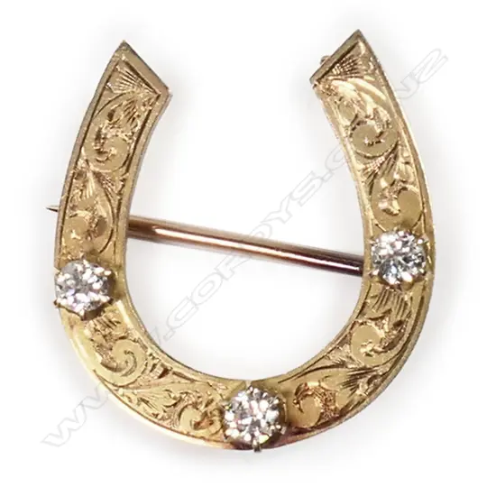 G & T Young Ltd. (Dunedin) gold and diamond horseshoe brooch,